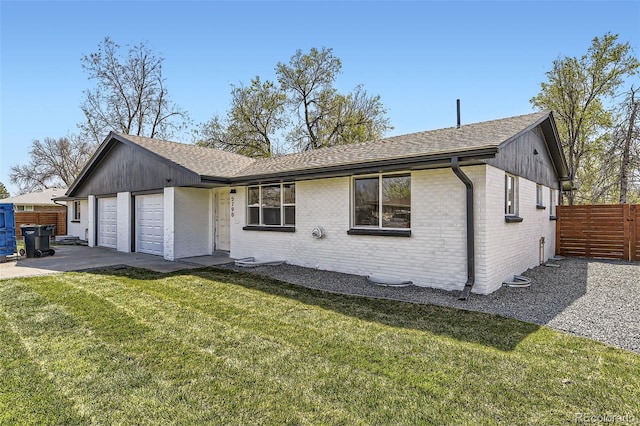 single story home featuring a front yard, brick siding, fence, and a shingled roof