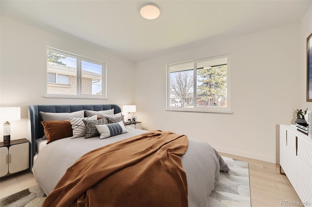 bedroom featuring light wood finished floors