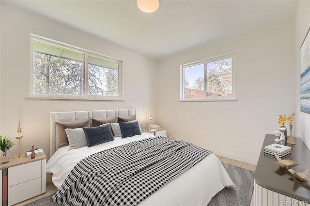 bedroom featuring baseboards