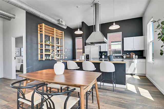 2501 15th St Unit 3F, Denver, CO 80211 - dining room featuring wood finished floors and baseboards