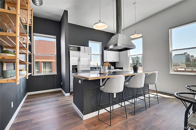2501 15th St Unit 3F, Denver, CO 80211 - kitchen with baseboards, dark wood-style flooring, a sink, and stainless steel refrigerator with ice dispenser