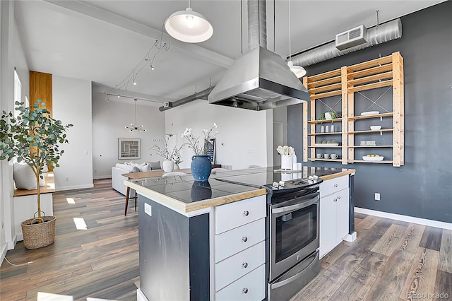 2501 15th St Unit 3F, Denver, CO 80211 - kitchen with island exhaust hood, stainless steel electric range oven, dark wood-style floors, rail lighting, and tile countertops