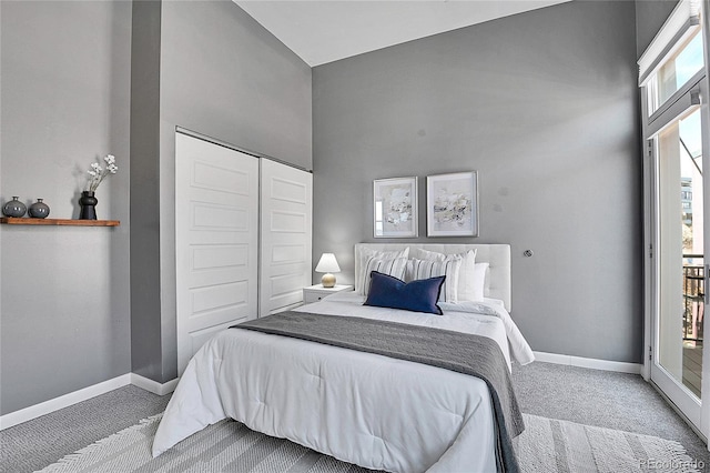 2501 15th St Unit 3F, Denver, CO 80211 - bedroom featuring carpet flooring, baseboards, a closet, and a high ceiling