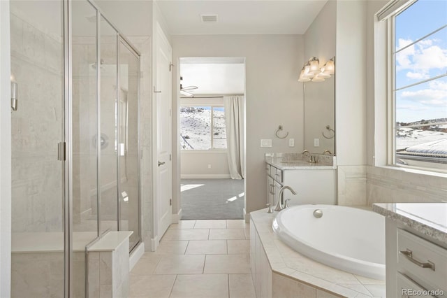 bathroom with vanity, tile patterned flooring, shower with separate bathtub, and ceiling fan