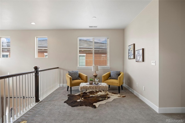 living area with carpet, baseboards, and recessed lighting