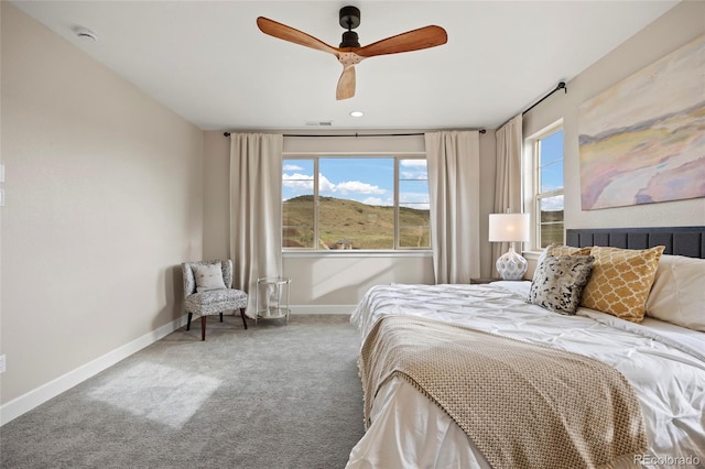 bedroom featuring carpet, baseboards, and ceiling fan