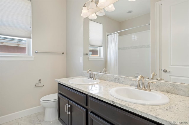 bathroom featuring toilet, tile patterned floors, baseboards, double vanity, and a shower with curtain