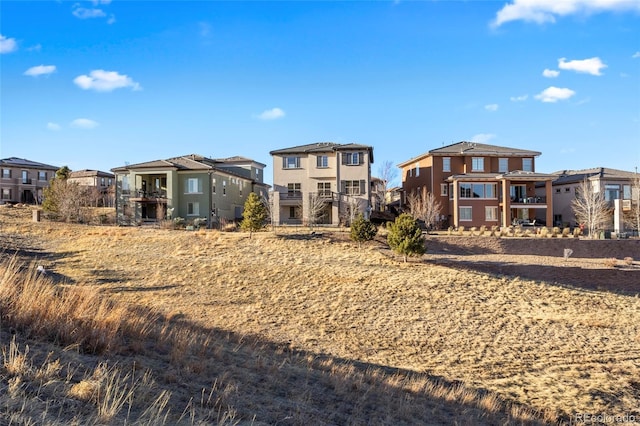 back of property with a residential view