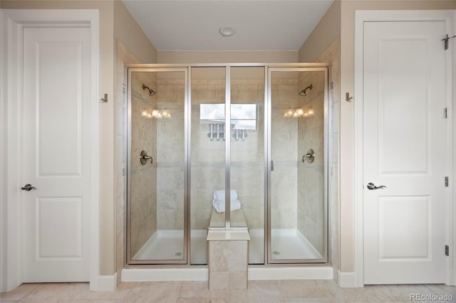 10659 Montecito Dr, Lone Tree, CO 80124 - bathroom with a shower stall, baseboards, and tile patterned flooring