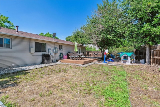 3253 S Kalispell St, Aurora, CO 80013 - view of yard featuring a wooden deck and outdoor dining space