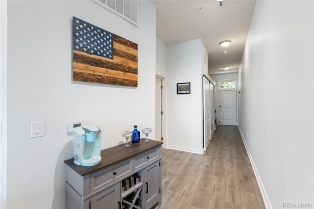 hall with light wood-type flooring