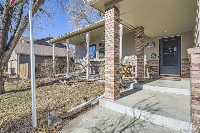 doorway to property featuring a porch