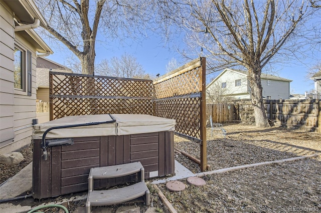 view of yard with ac unit and a hot tub