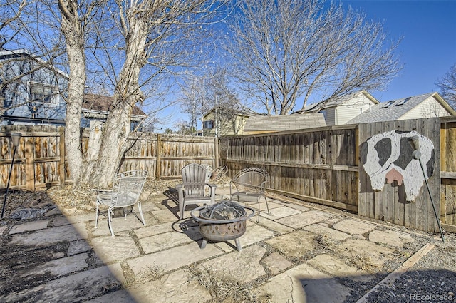 view of patio / terrace with a fire pit