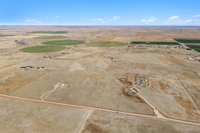 birds eye view of property with a rural view