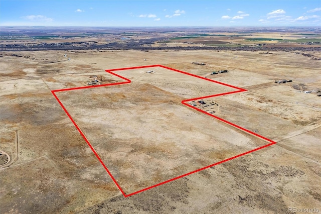 birds eye view of property with a rural view