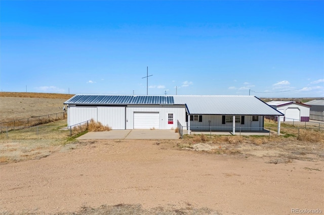 view of front facade with an outdoor structure and a garage