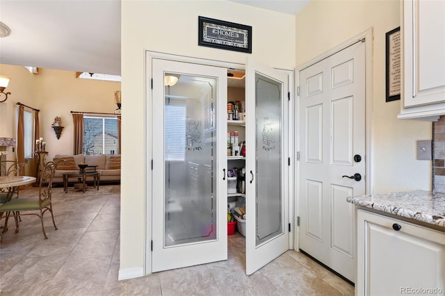 bathroom with tile patterned floors