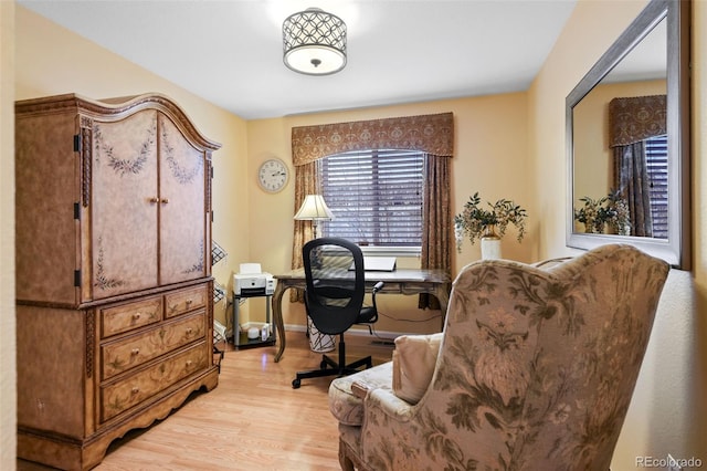 home office featuring light wood-style flooring and baseboards