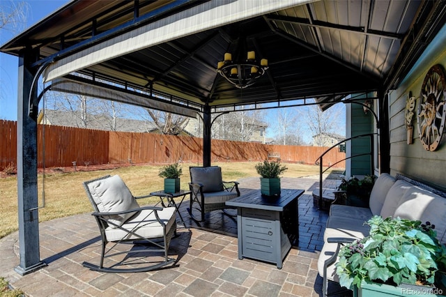 view of patio / terrace featuring a gazebo and a fenced backyard