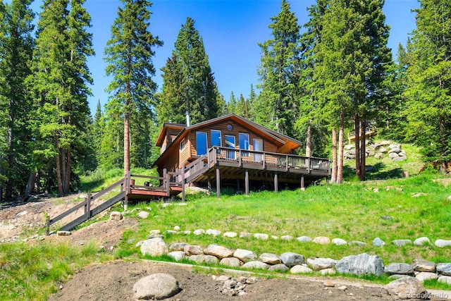 back of house featuring a wooden deck