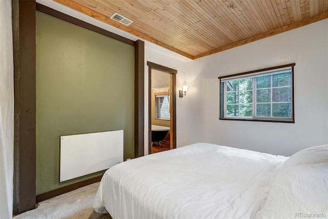 bedroom featuring carpet floors, ensuite bath, and wooden ceiling