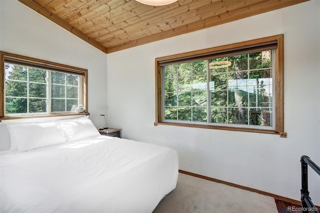 bedroom with lofted ceiling and wooden ceiling