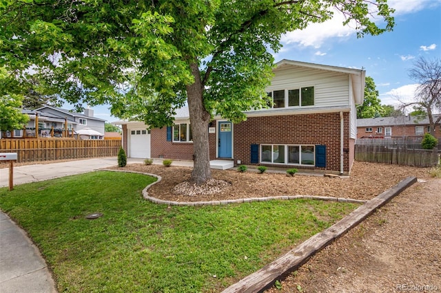 1011 Yeager Dr, Longmont, CO 80501 - split level home with brick siding, a garage, and concrete driveway