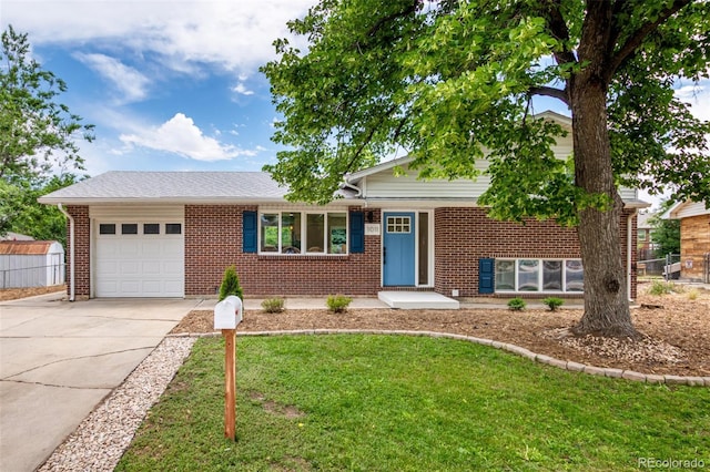 1011 Yeager Dr, Longmont, CO 80501 - view of front of property featuring an attached garage, concrete driveway, and brick siding