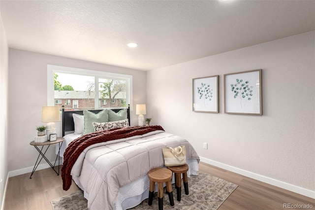 1011 Yeager Dr, Longmont, CO 80501 - bedroom with wood finished floors and recessed lighting