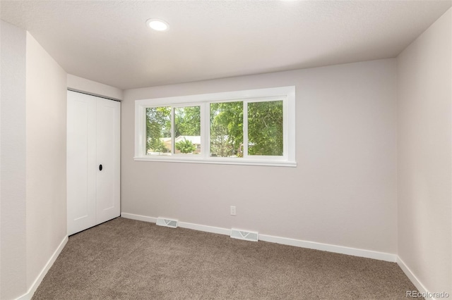 1011 Yeager Dr, Longmont, CO 80501 - unfurnished bedroom with carpet flooring, a closet, and recessed lighting