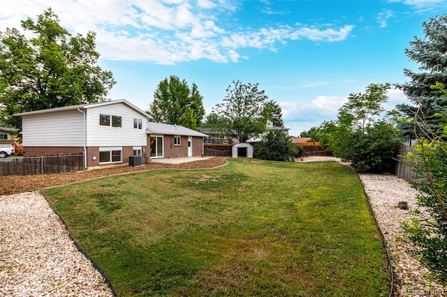1011 Yeager Dr, Longmont, CO 80501 - fenced backyard featuring a storage unit and a patio area