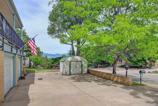 8300 W 67th Ave, Arvada, CO 80004 - view of patio with a shed and a mountain view