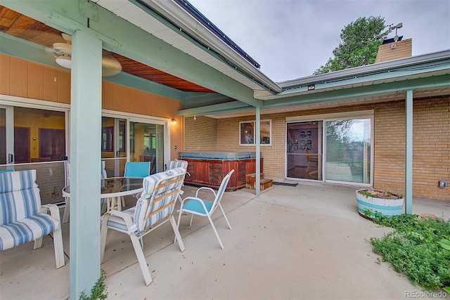 8300 W 67th Ave, Arvada, CO 80004 - view of patio with a hot tub and outdoor dining area