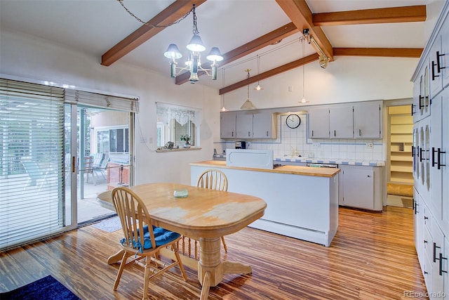 8300 W 67th Ave, Arvada, CO 80004 - dining room featuring light wood-type flooring and a chandelier