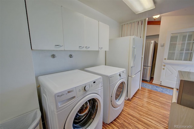 8300 W 67th Ave, Arvada, CO 80004 - laundry area with washer and dryer and light wood-style floors