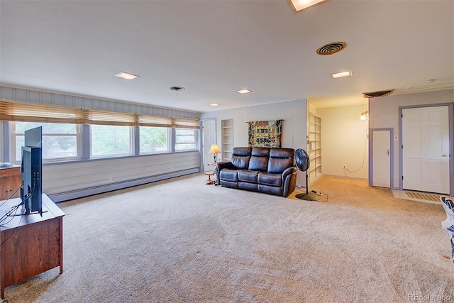 8300 W 67th Ave, Arvada, CO 80004 - carpeted living area featuring baseboard heating and built in features