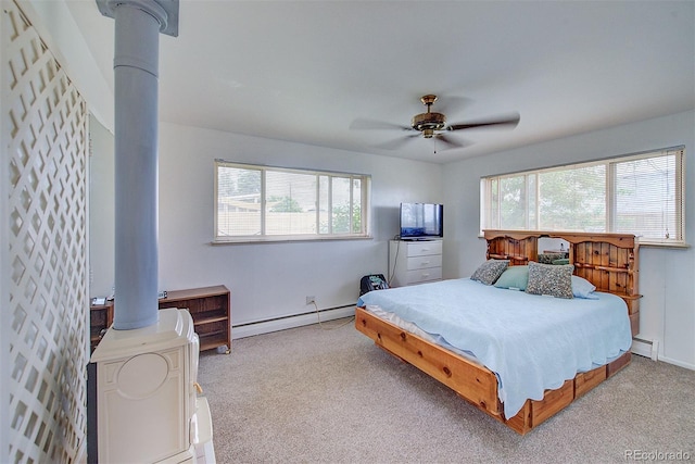 8300 W 67th Ave, Arvada, CO 80004 - bedroom featuring a baseboard radiator, multiple windows, and carpet floors