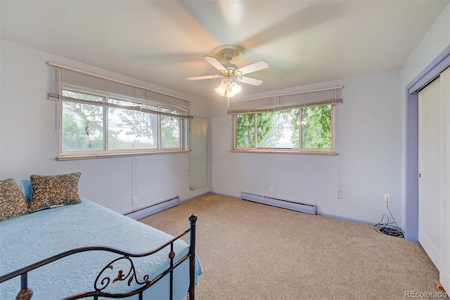 8300 W 67th Ave, Arvada, CO 80004 - bedroom featuring a baseboard radiator, carpet flooring, a closet, and ceiling fan
