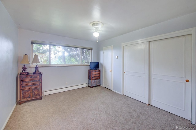 8300 W 67th Ave, Arvada, CO 80004 - carpeted bedroom featuring baseboard heating and a closet