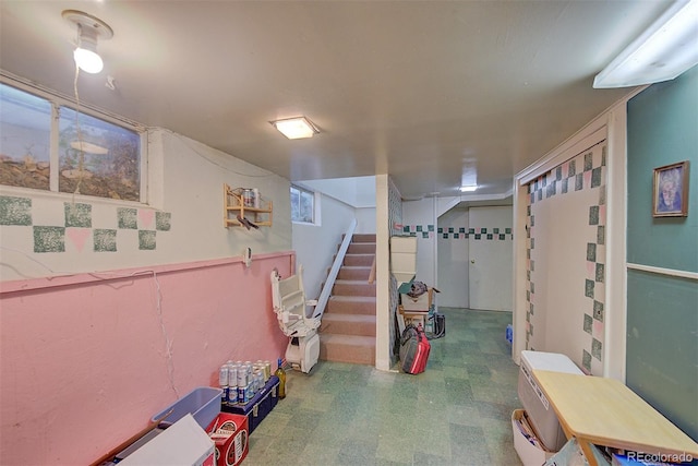 8300 W 67th Ave, Arvada, CO 80004 - finished below grade area with tile patterned floors and stairway