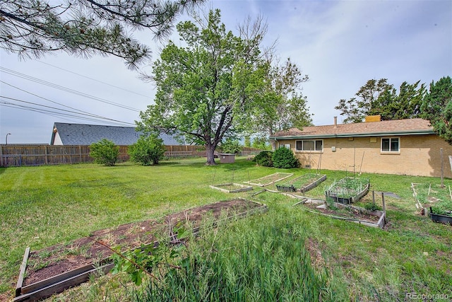 8300 W 67th Ave, Arvada, CO 80004 - fenced yard featuring a vegetable garden