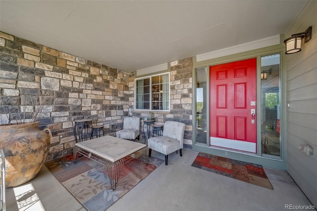 22227 E Hinsdale Ave, Aurora, CO 80016 - view of exterior entry with a porch and stone siding