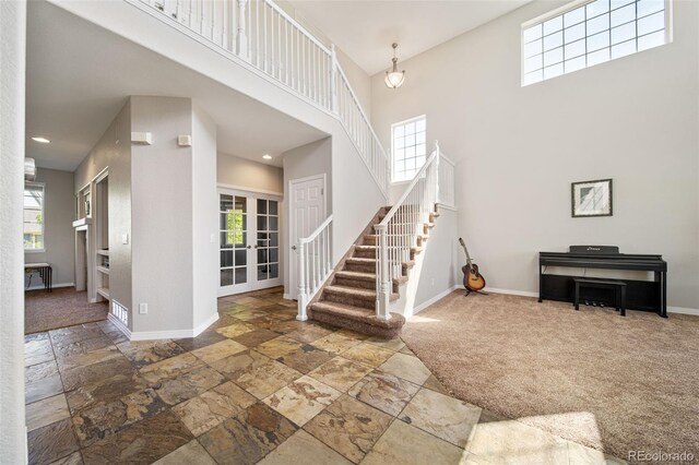 22227 E Hinsdale Ave, Aurora, CO 80016 - entrance foyer with a high ceiling, stone tile flooring, healthy amount of natural light, and recessed lighting