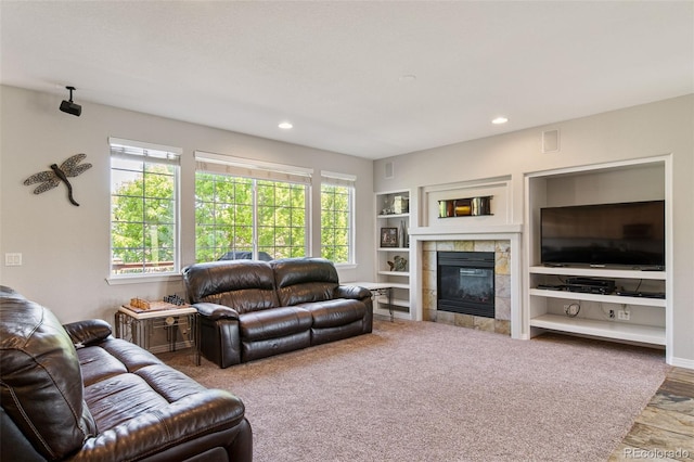 22227 E Hinsdale Ave, Aurora, CO 80016 - living room featuring plenty of natural light, recessed lighting, and a fireplace