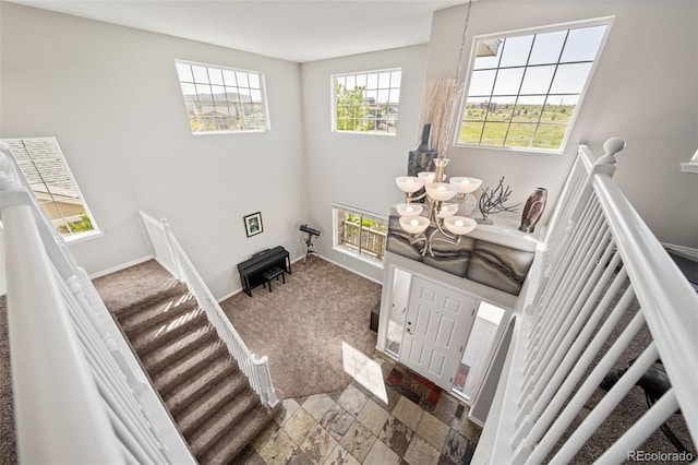 22227 E Hinsdale Ave, Aurora, CO 80016 - foyer entrance featuring a chandelier and baseboards