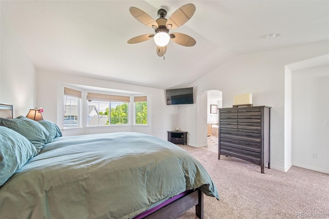 22227 E Hinsdale Ave, Aurora, CO 80016 - bedroom with lofted ceiling, light colored carpet, arched walkways, a ceiling fan, and ensuite bathroom