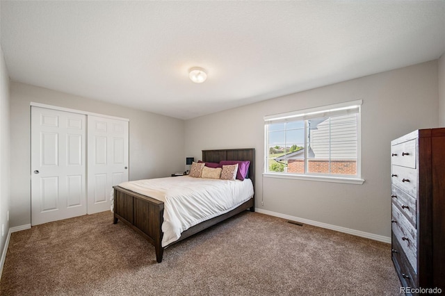 22227 E Hinsdale Ave, Aurora, CO 80016 - bedroom featuring carpet floors, a closet, and baseboards