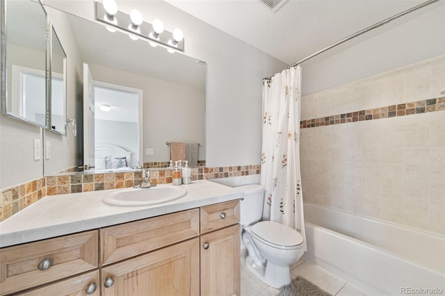 22227 E Hinsdale Ave, Aurora, CO 80016 - ensuite bathroom with vanity, shower / tub combo, toilet, and tile patterned floors