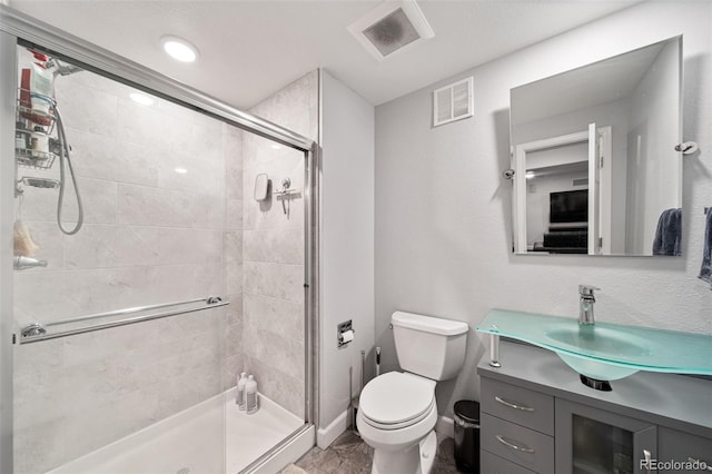 22227 E Hinsdale Ave, Aurora, CO 80016 - bathroom featuring toilet, a shower stall, and vanity